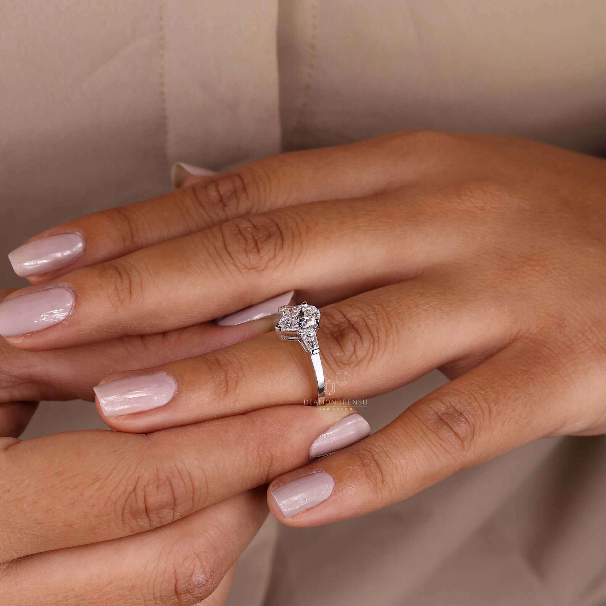 Pear and baguette engagement ring handmade with love in the UK.