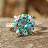 Rose gold hidden halo pave engagement ring with round cut moissanite.