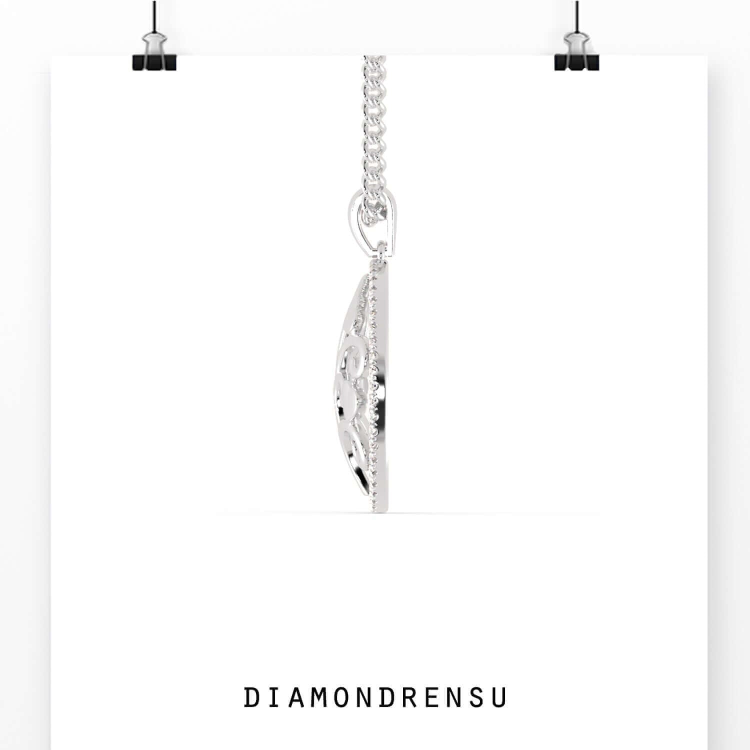 UK diamond pendant paired with matching gold tree pendant.