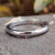 Elegant white gold wedding band with a timeless design. Elegant white gold wedding band with a timeless design.