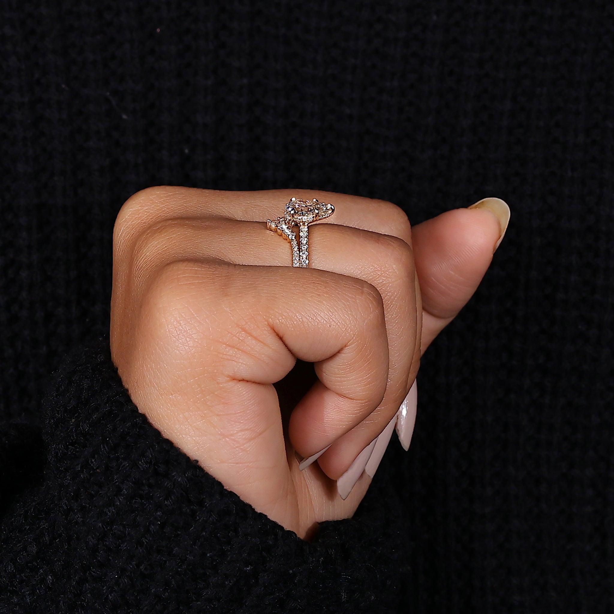 Yellow gold pear engagement ring set.