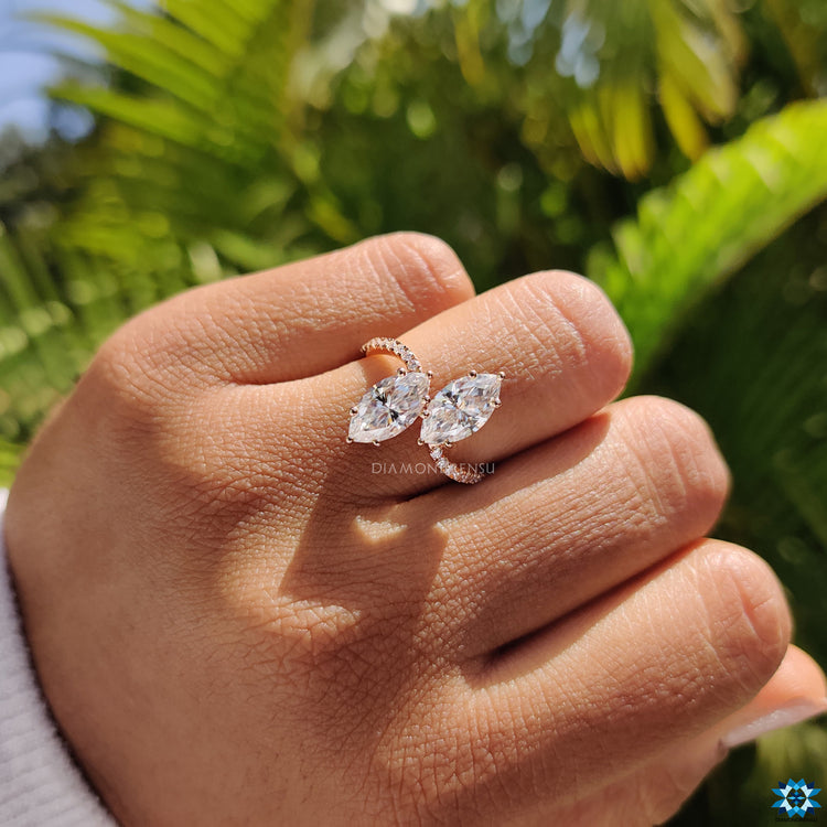 Moissanite ring UK with prong setting and round cut pave detailing.