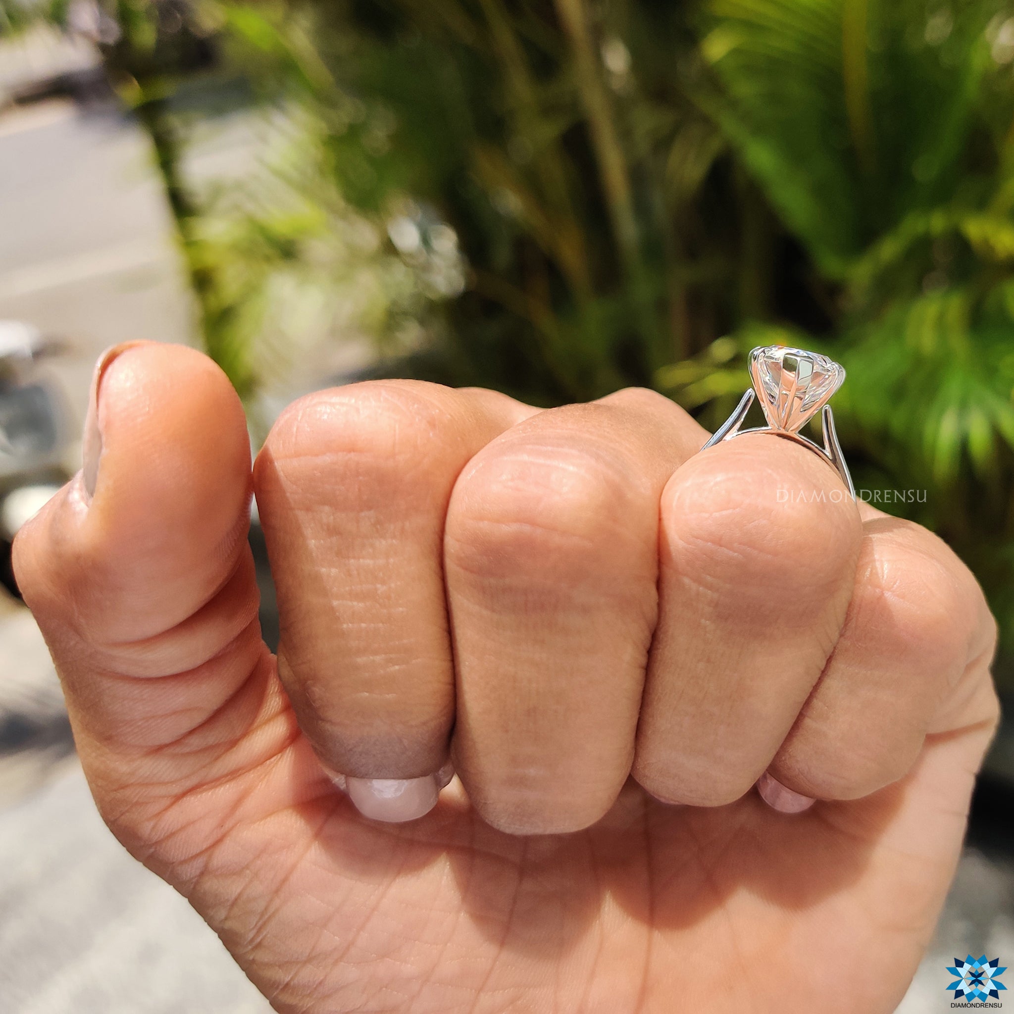 Moissanite for an engagement ring in timeless pear Rensu cut and 5 prong solitaire mount.