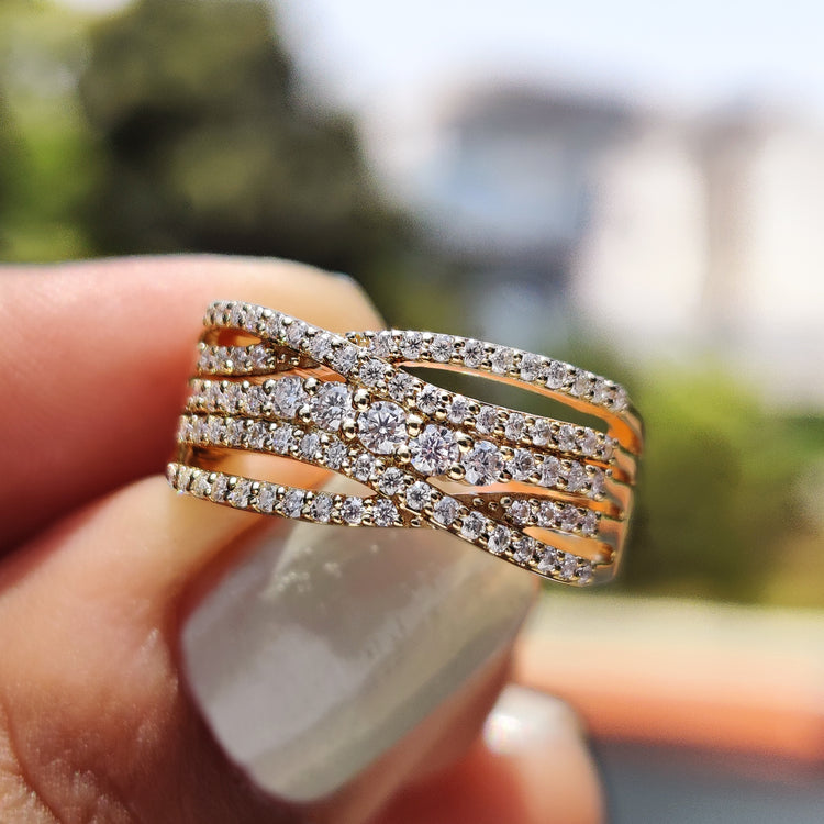 Criss cross ring with multi row pave moissanite in yellow gold.