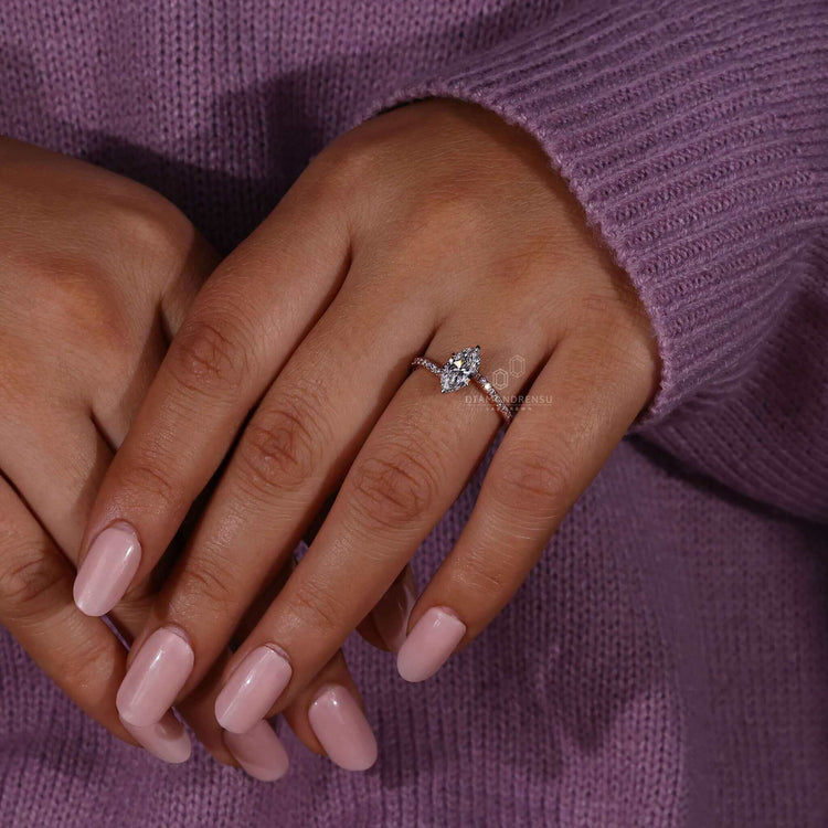 Marquise diamond ring set in a claw prong engagement ring style, ideal for proposals or special moments.