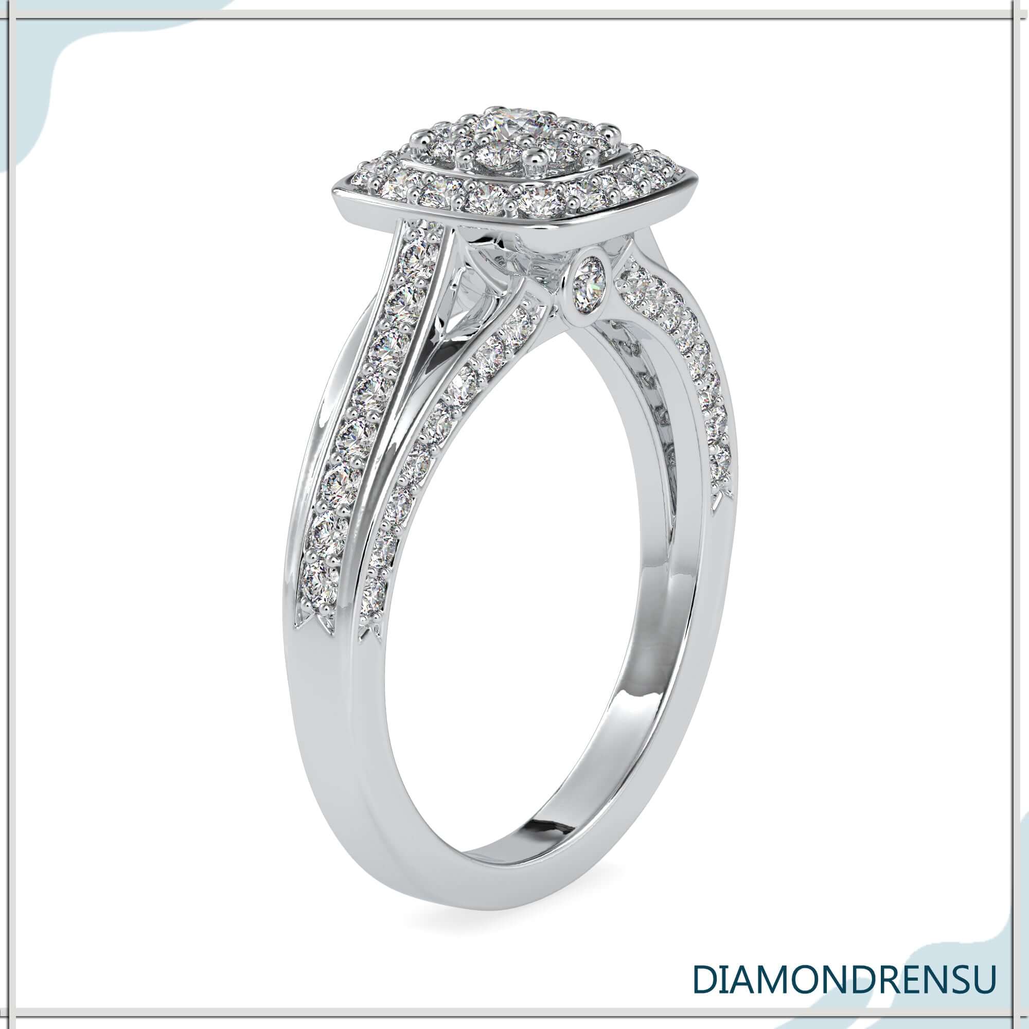 White gold ring with round cut diamond and bridge detail.