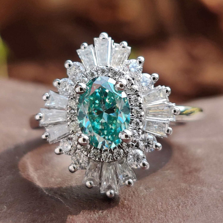 Antique vintage ring with cyan blue moissanite.