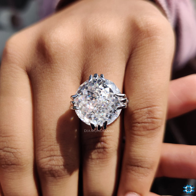 Diamondrensu UK engagement ring with Portuguese cut moissanite and milgrain detail.