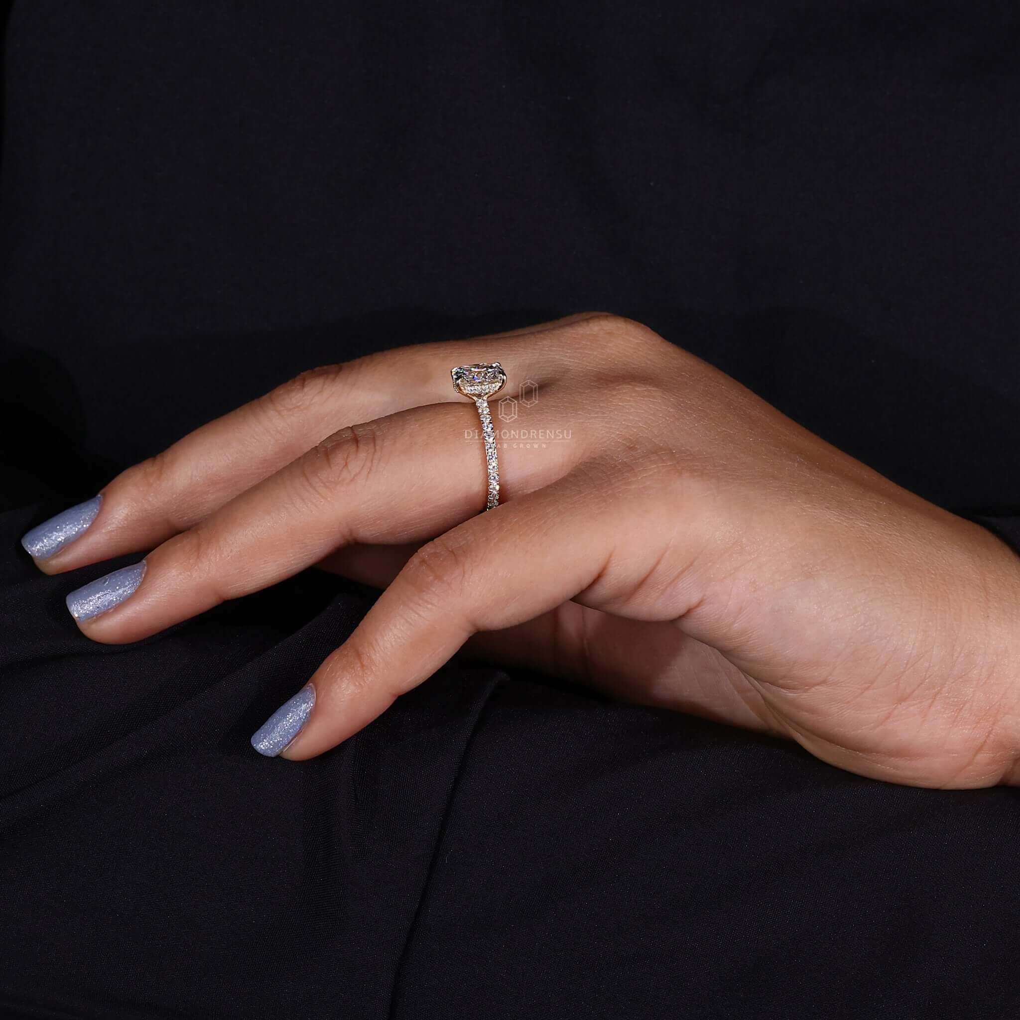 Handmade ring featuring claw prong setting and an elongated cushion cut diamond.