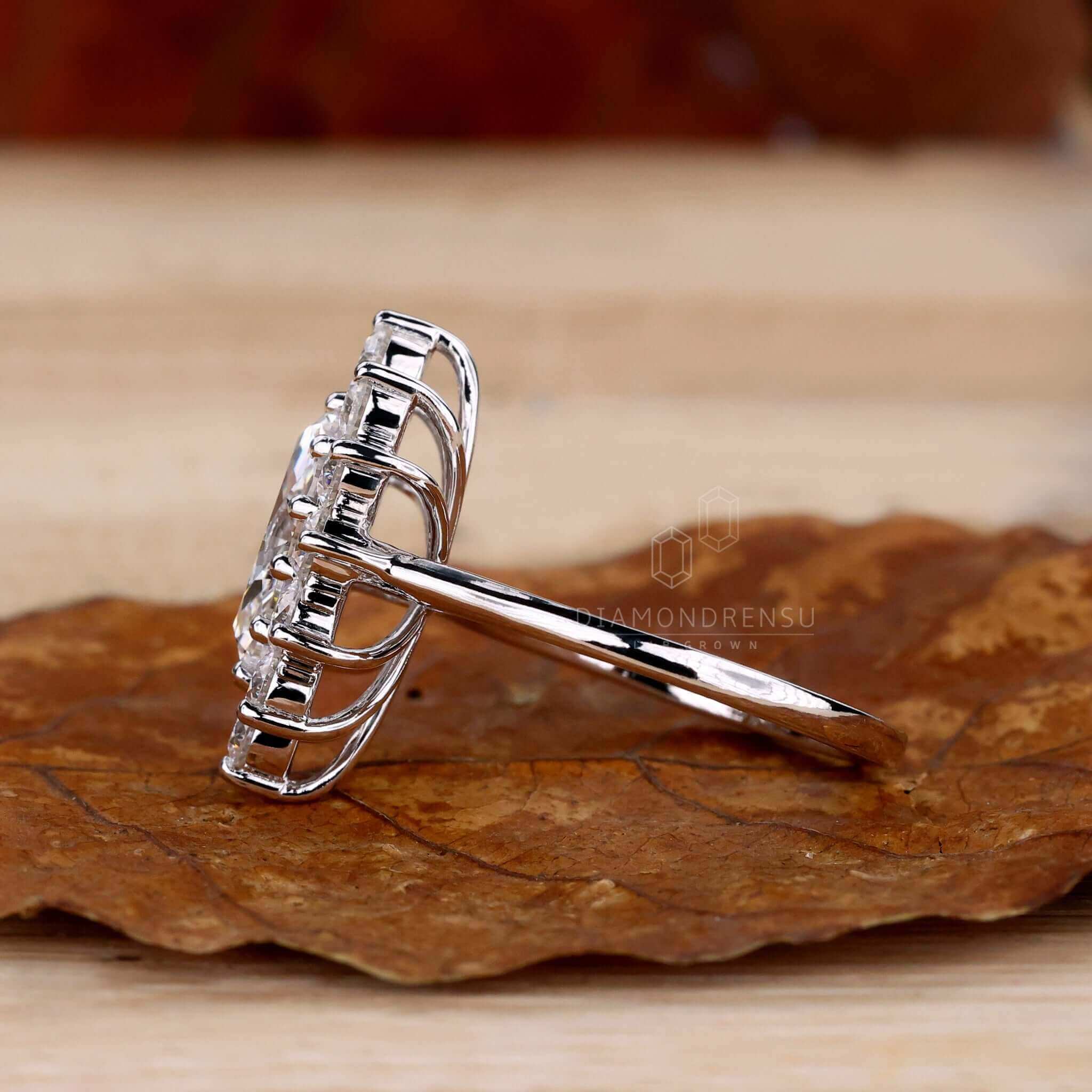 Cluster diamond ring in marquise cut with prong round diamond engagement ring style, perfect for special occasions.