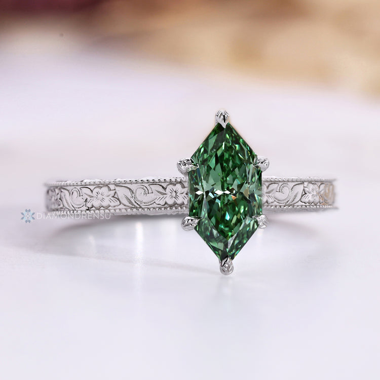 Lab grown green diamond ring with six leaf prong setting.