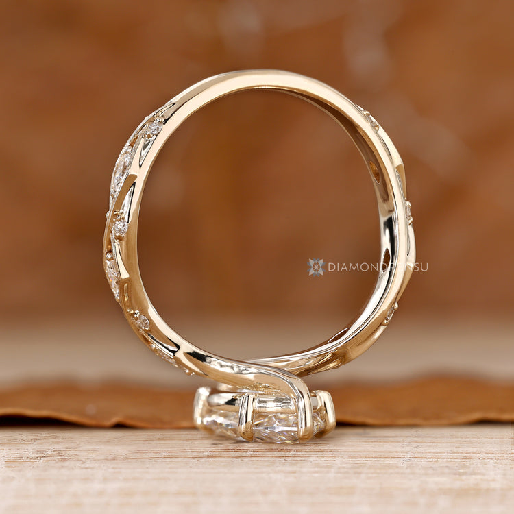 Vintage style marquise diamond ring with bypass setting.