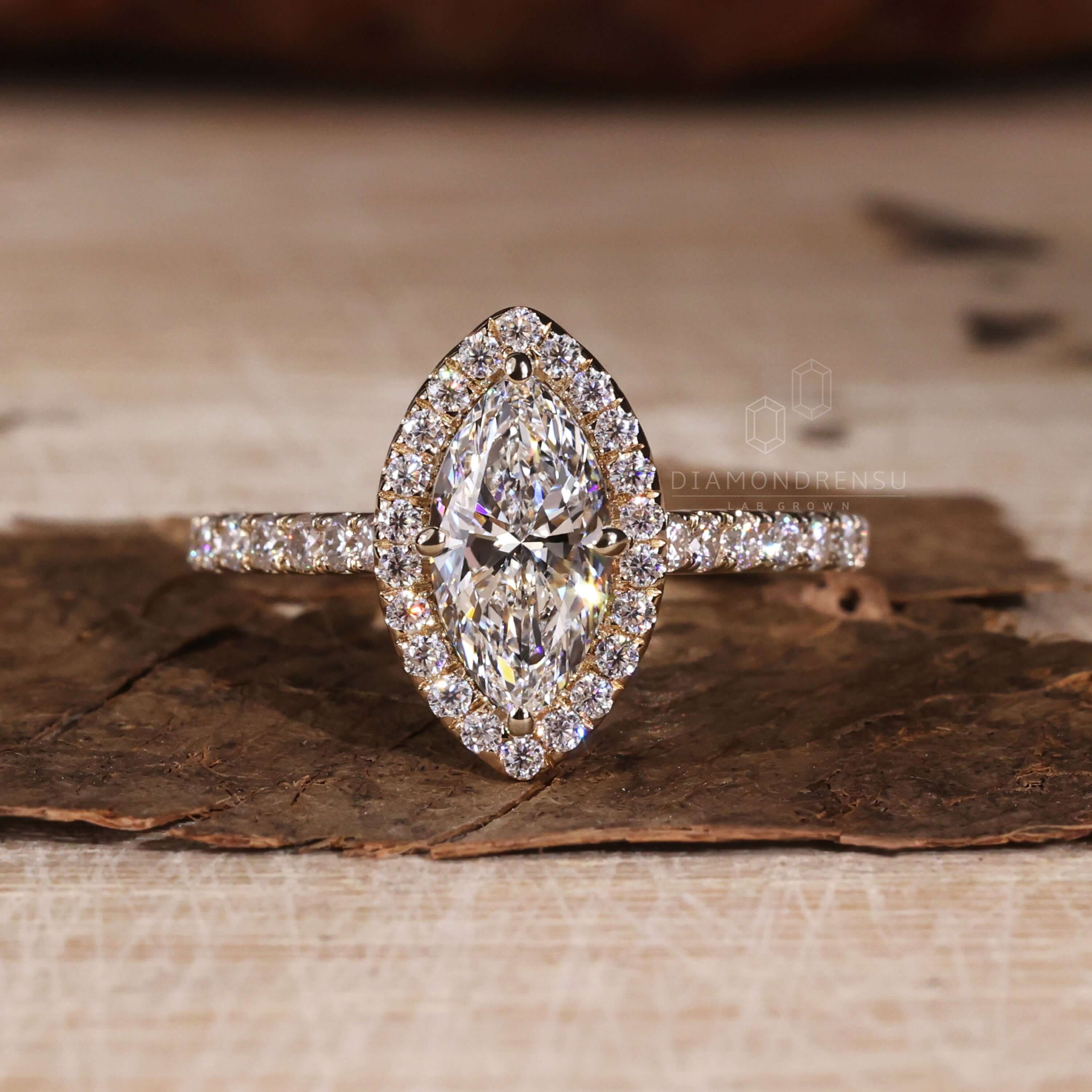 Marquise cut diamond highlighted in a cathedral setting ring