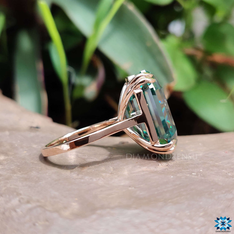 Moissanite solitaire ring with cathedral setting.