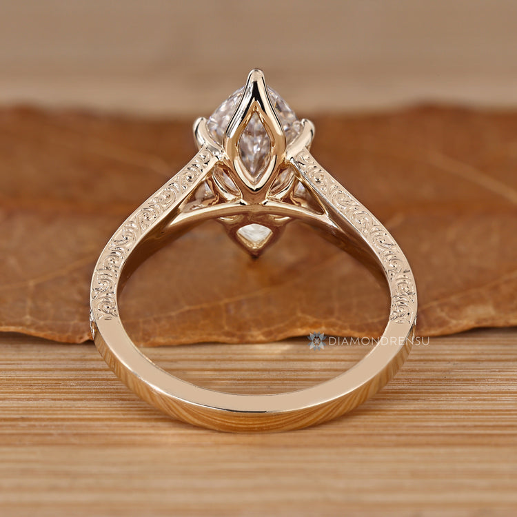 Handmade lab grown diamond ring with six claw prongs.