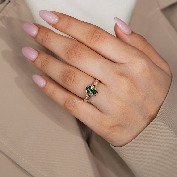 Coffin cut solitaire ring with cathedral setting.