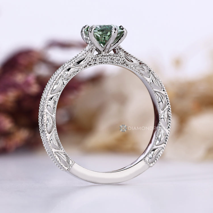 Art Deco green diamond ring with cathedral setting.