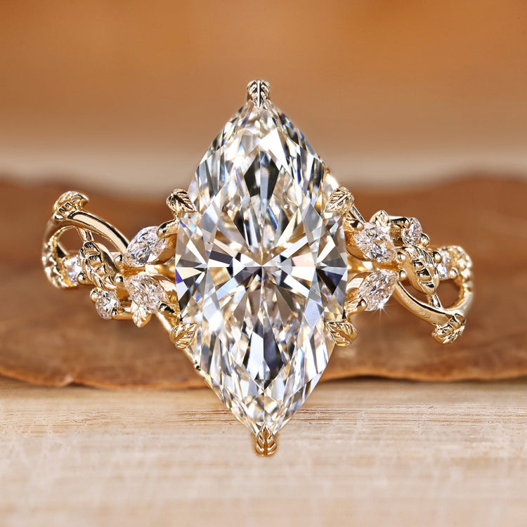 Marquise diamond ring with marquise and round side stones.