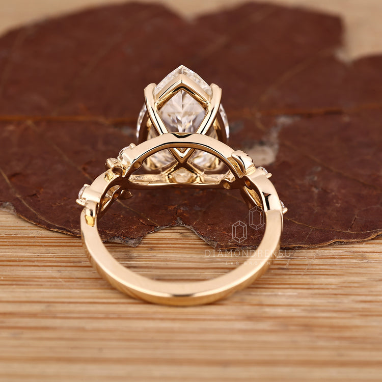 Lab grown diamond ring with round side stone accents.