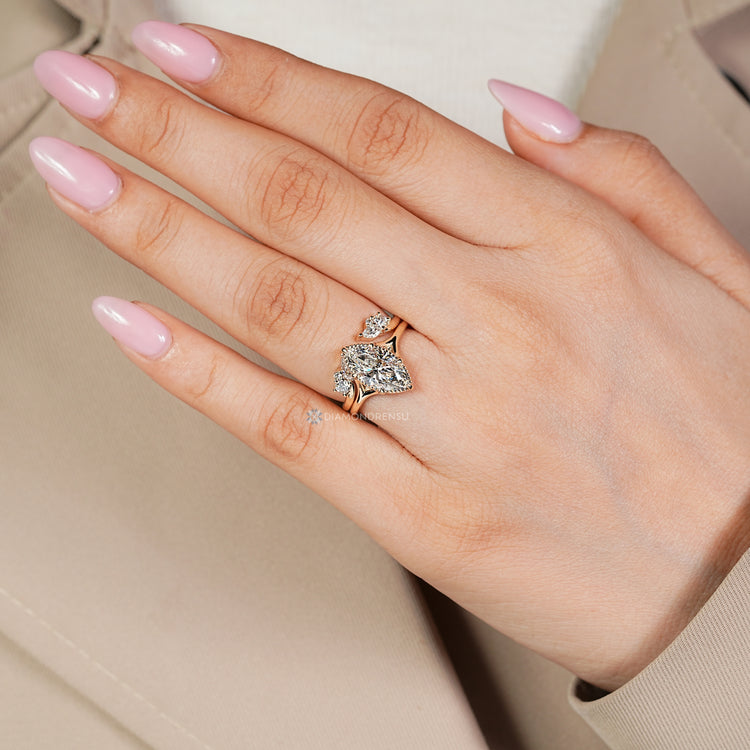 Marquise centre diamond ring with open gap band.