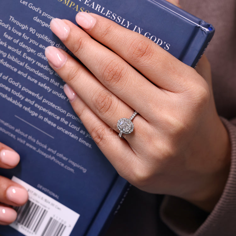 IGI certified cushion diamond ring with halo and prongs.
