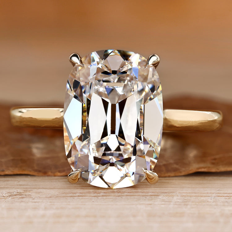 Solitaire engagement ring with cushion OMC diamond.