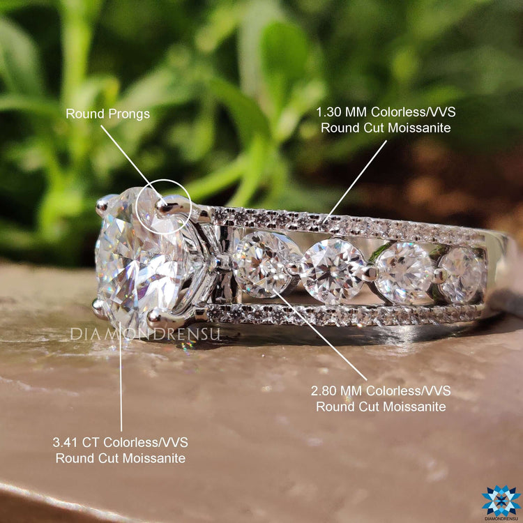 Diamondrensu UK ring with round side stone accents.
