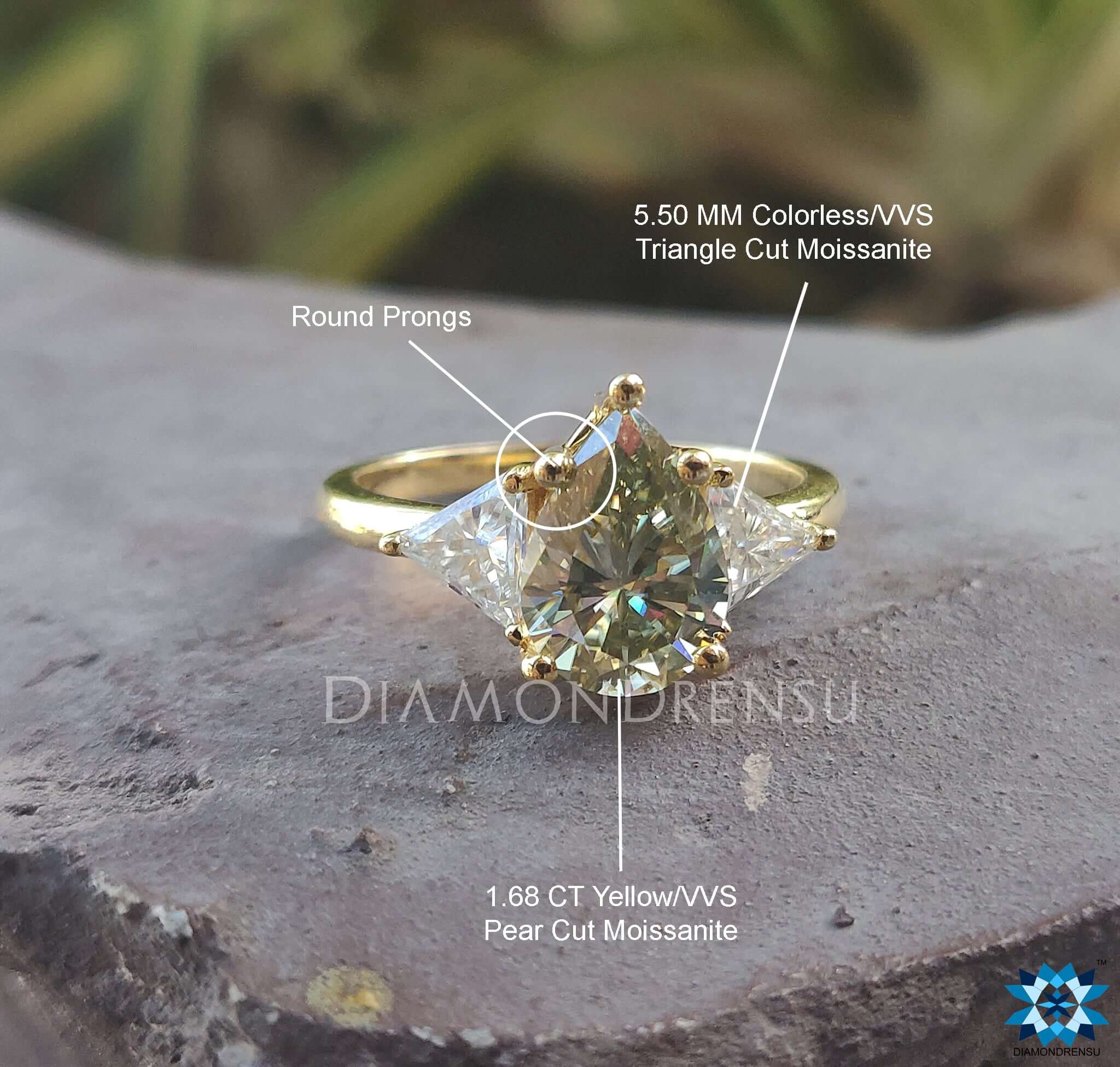 Diamondrensu UK engagement ring featuring pear and triangle moissanite.