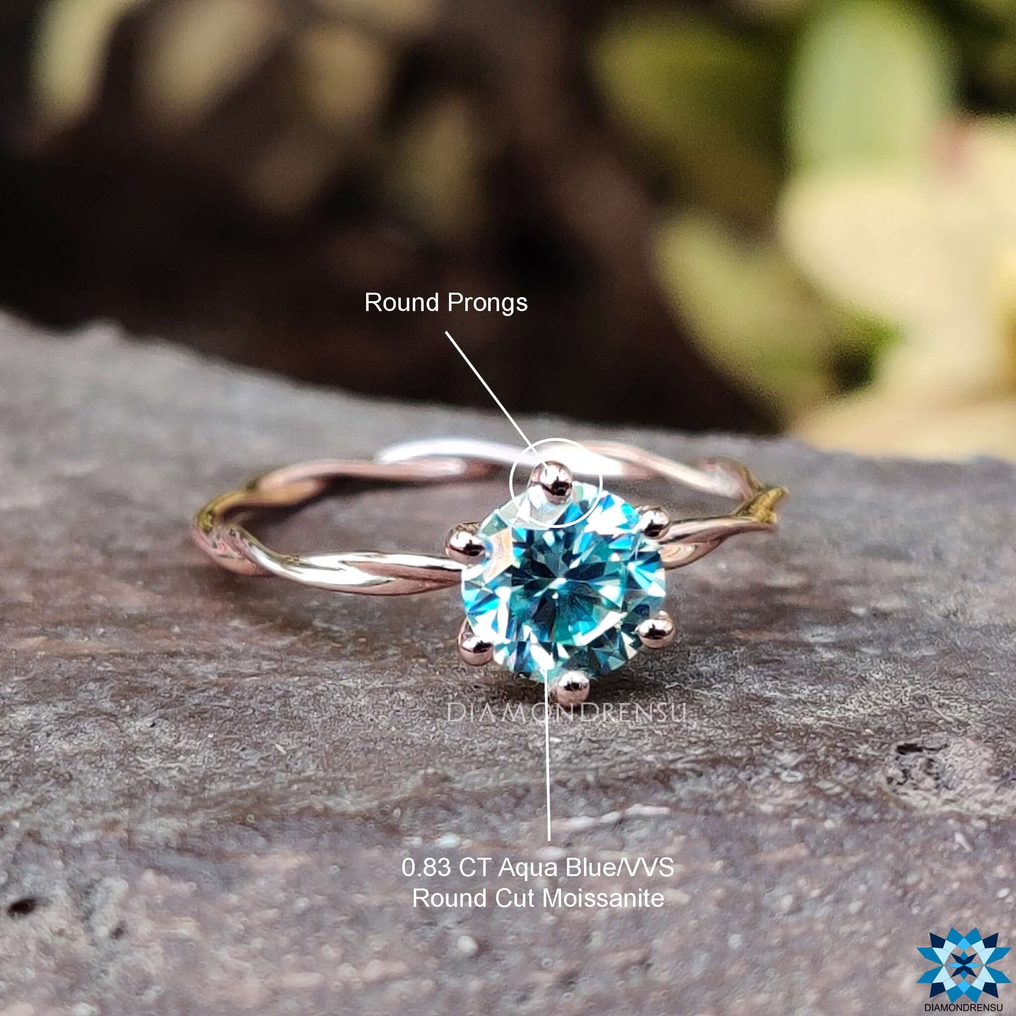Moissanite ring with a unique twisted band design.