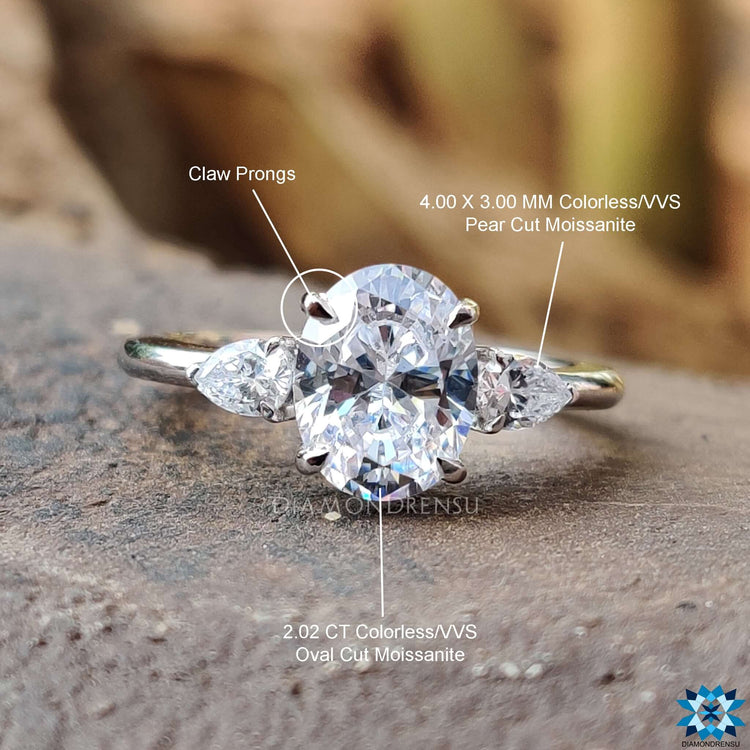 Handmade moissanite ring with oval center stone.