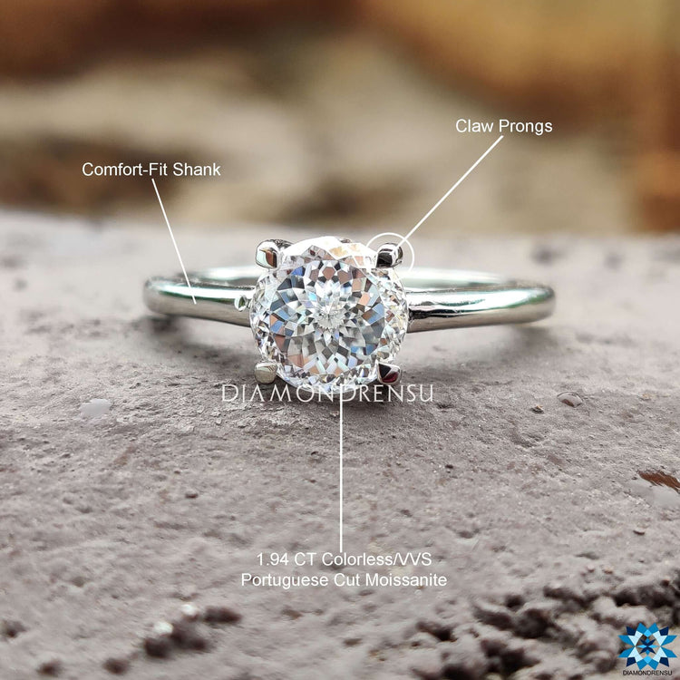 White gold solitaire ring featuring moissanite center.