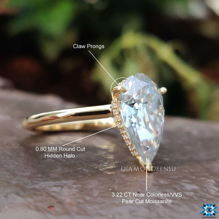 Buy custom moissanite pear solitaire ring online.