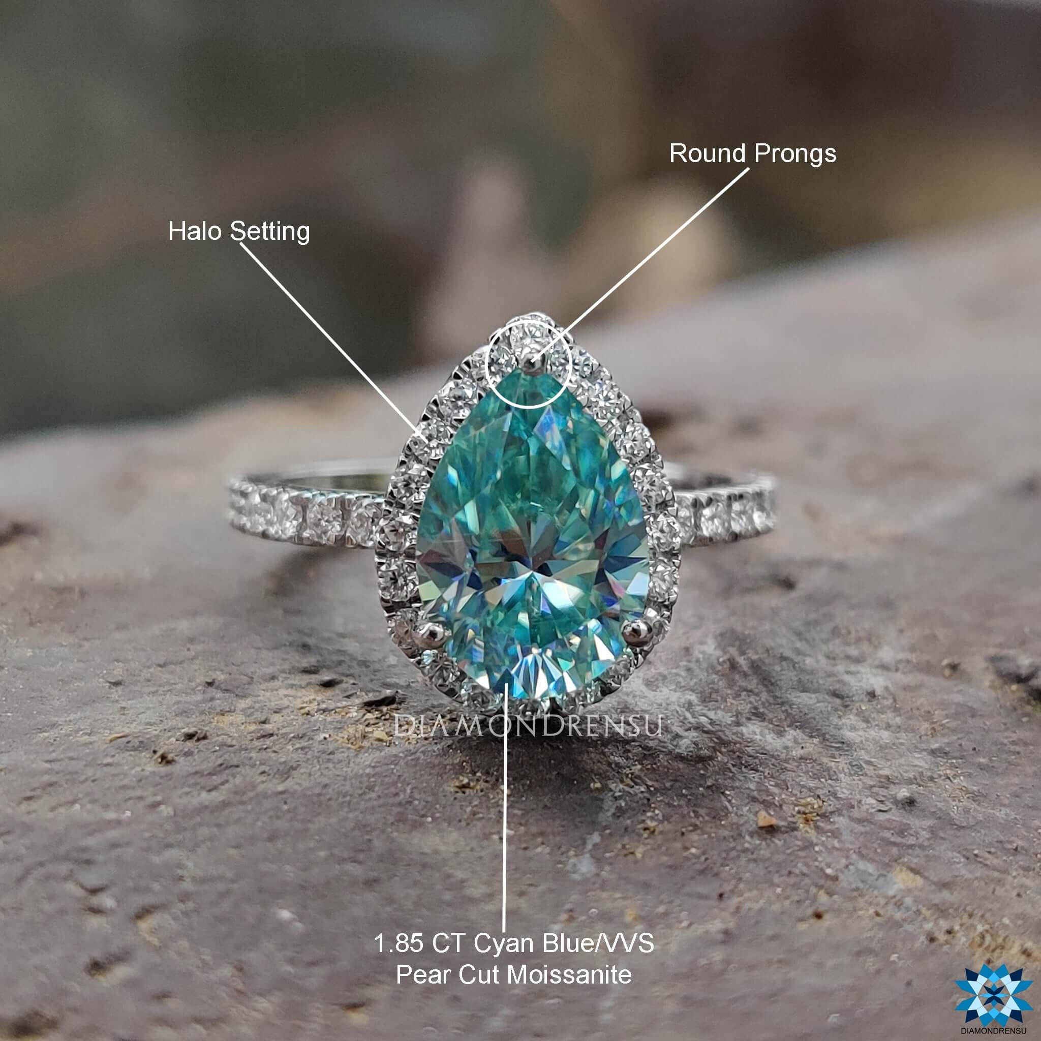 White gold moissanite ring with handcrafted detail and halo setting.