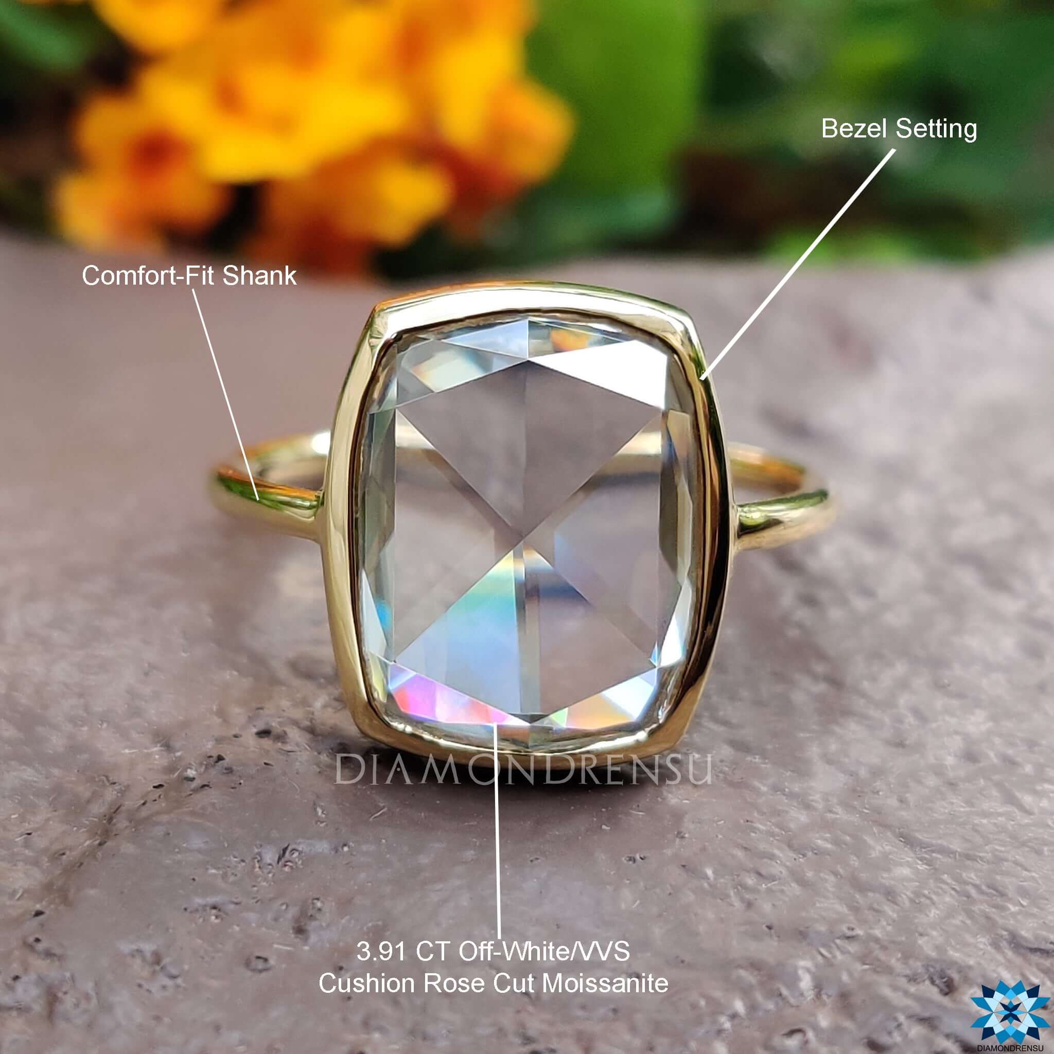 Custom bezel setting ring with elongated cushion moissanite.