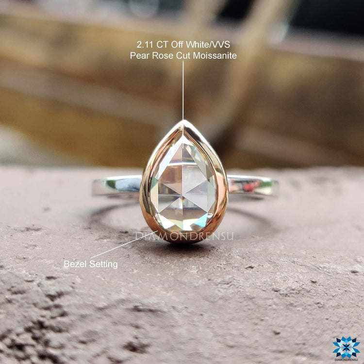 Buy pear shaped moissanite ring with bezel setting.