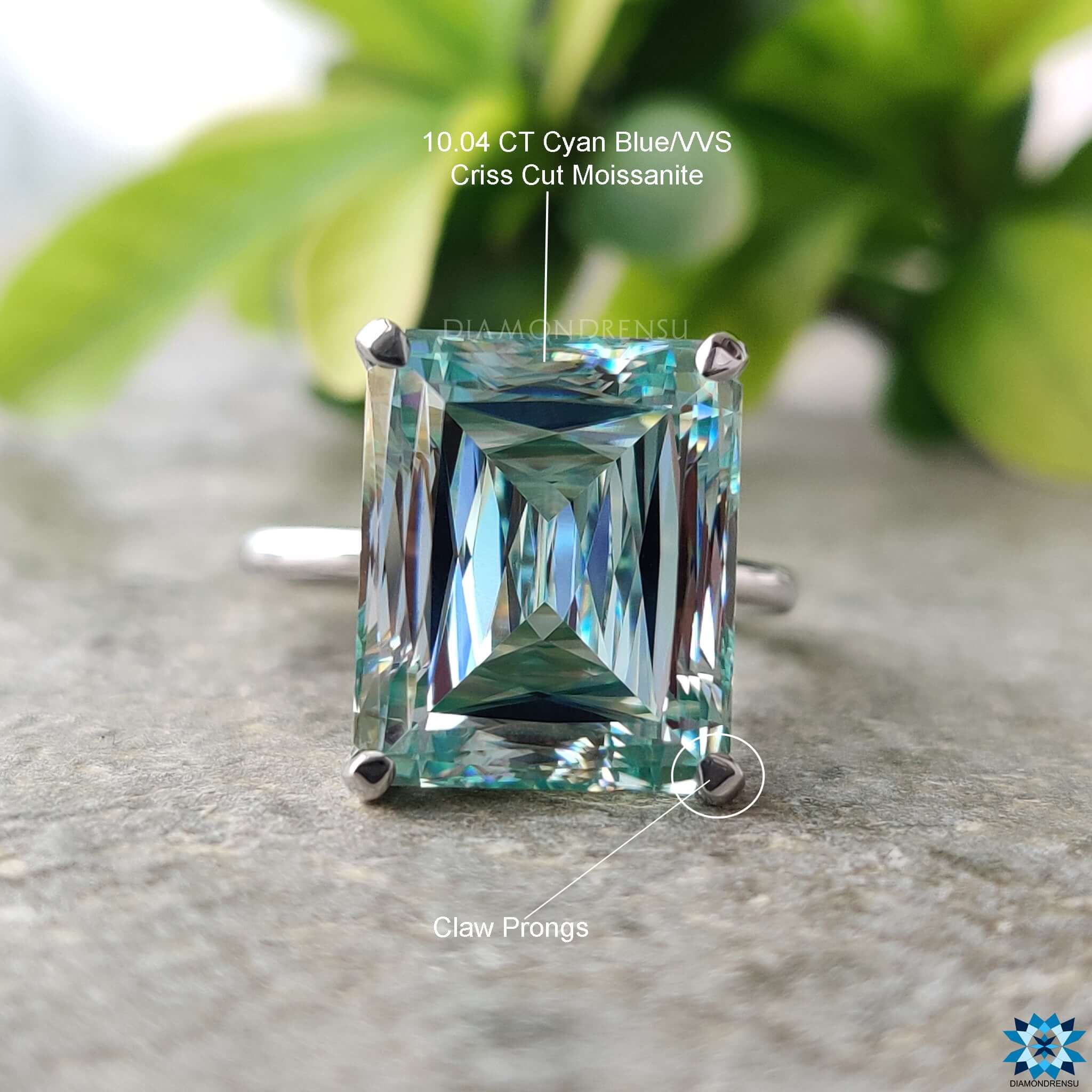 Handmade ring with solitaire criss cut moissanite in white gold.