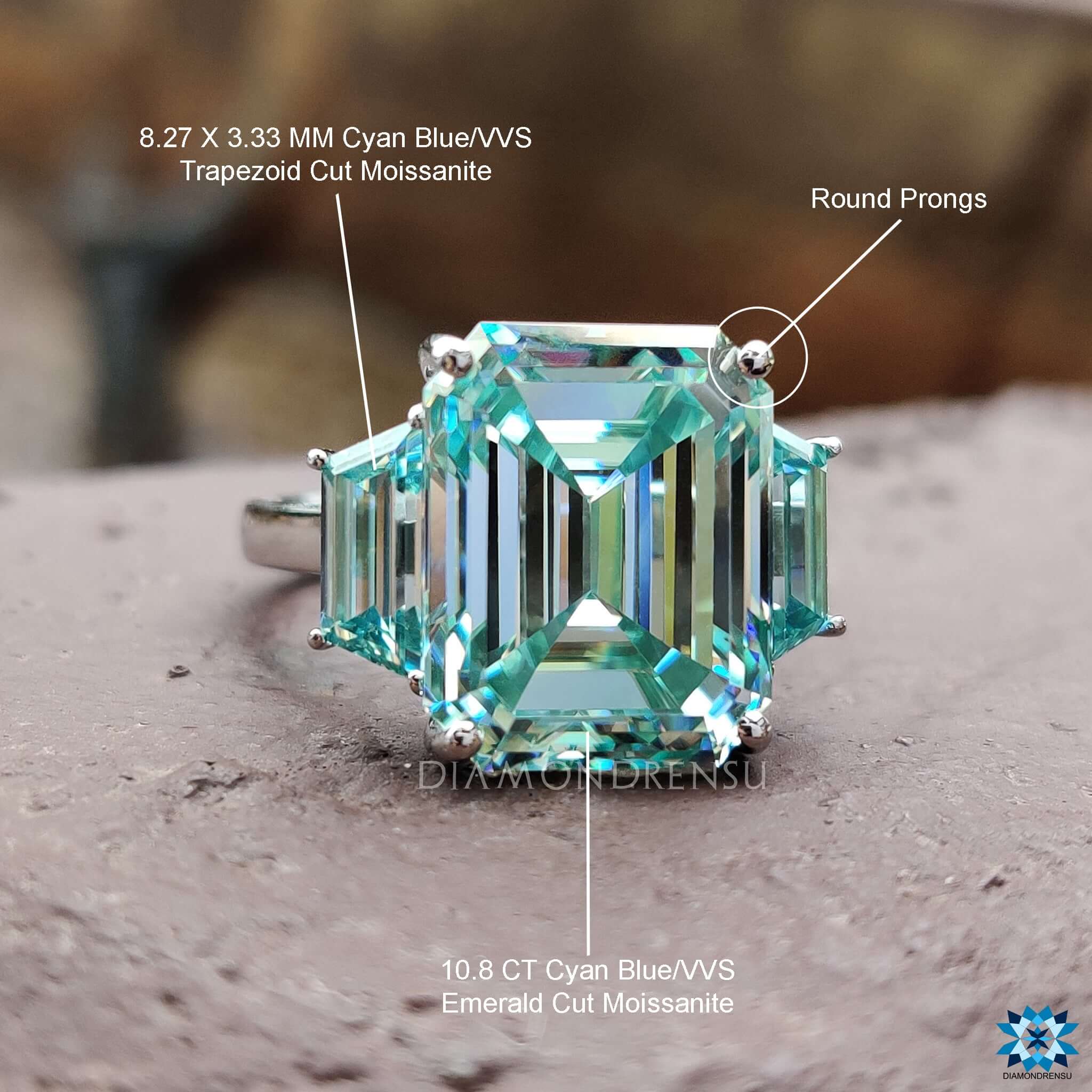 Trapezoid and emerald moissanite stones in classic layout.