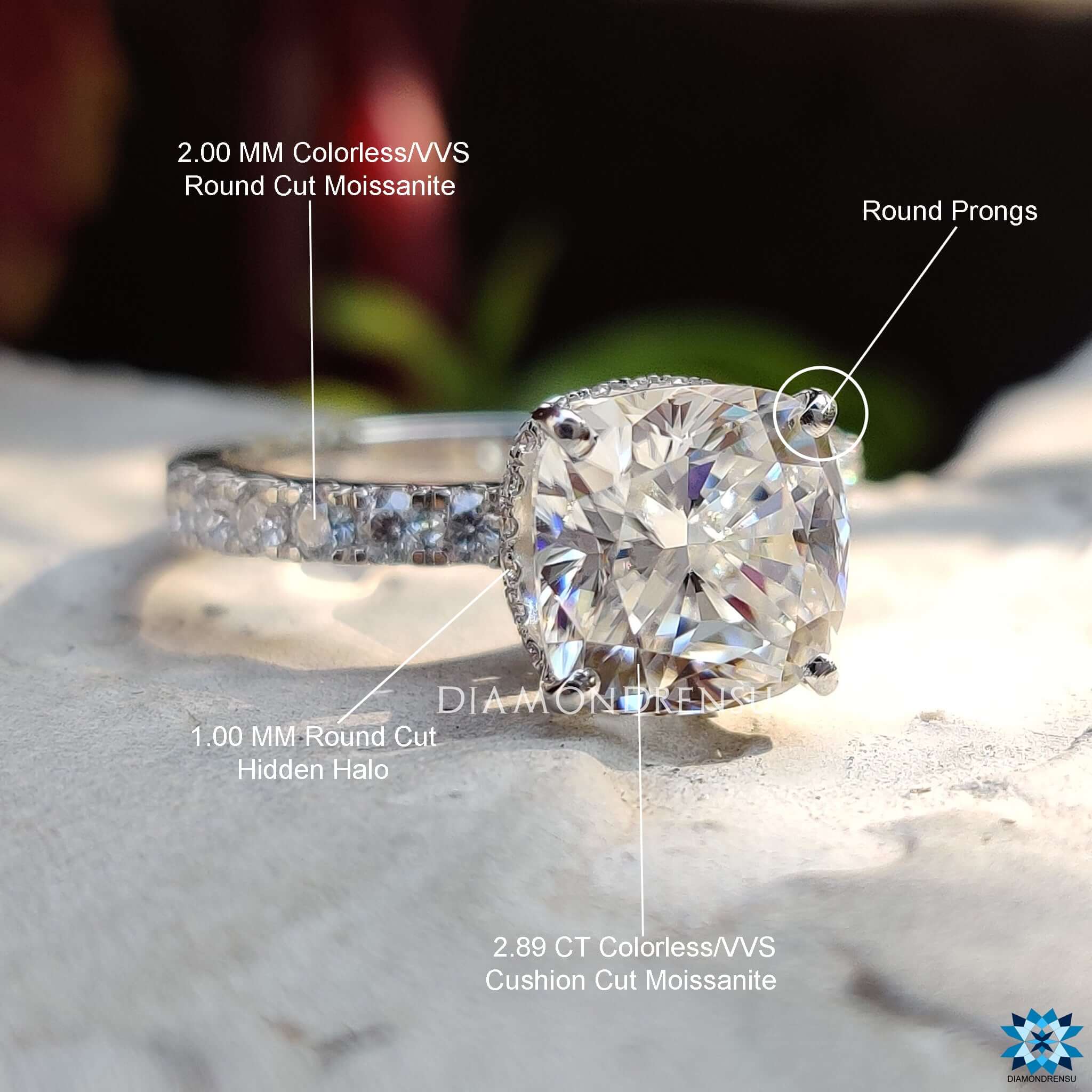 Elegant cushion moissanite ring with halo accents.