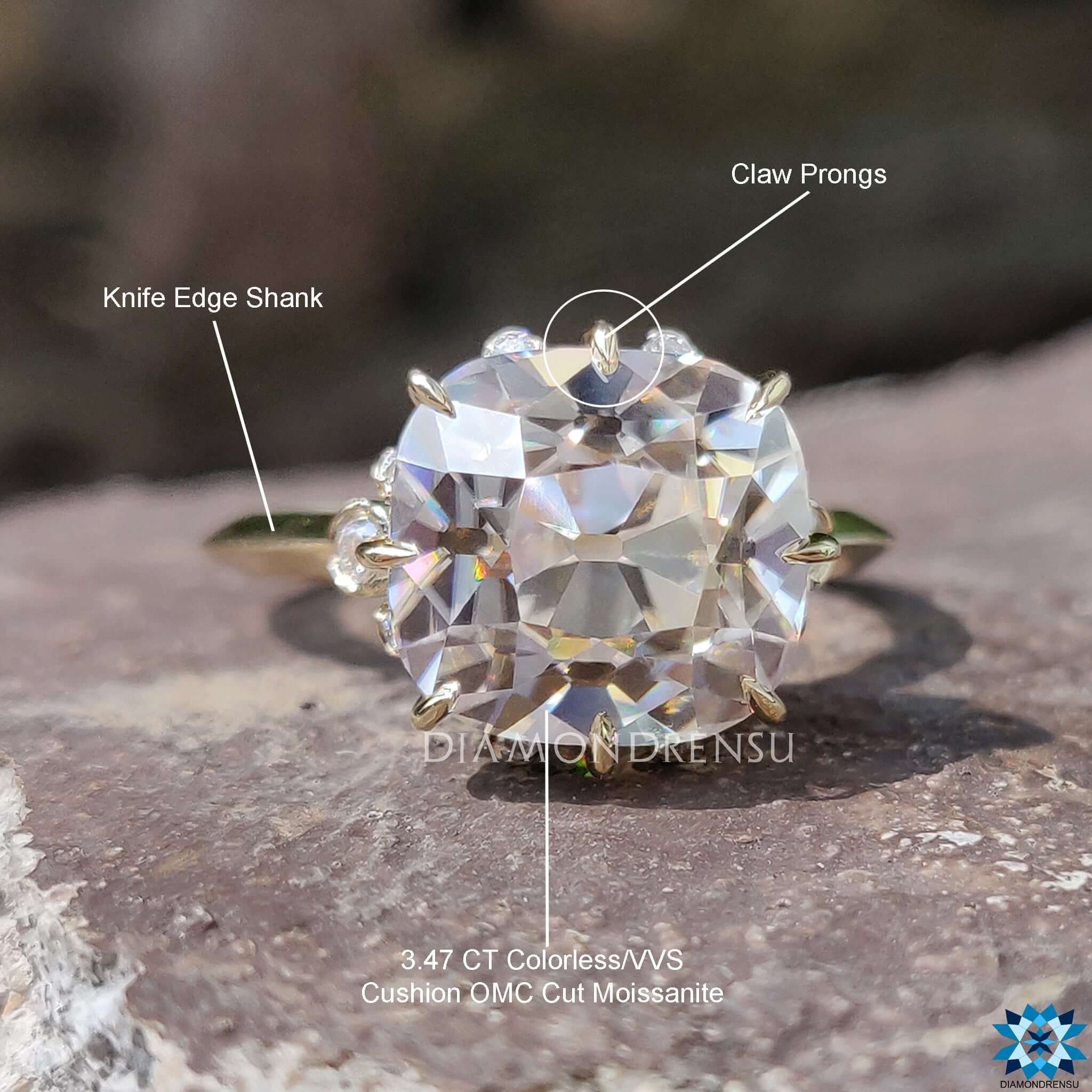 Antique-inspired moissanite engagement ring in yellow gold.