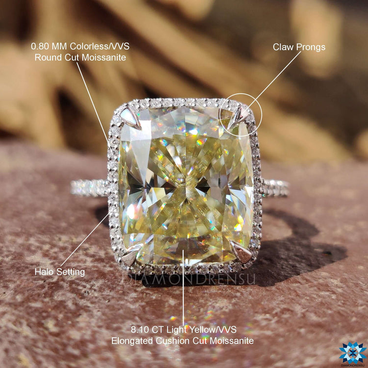Cushion halo engagement ring with pave diamonds.