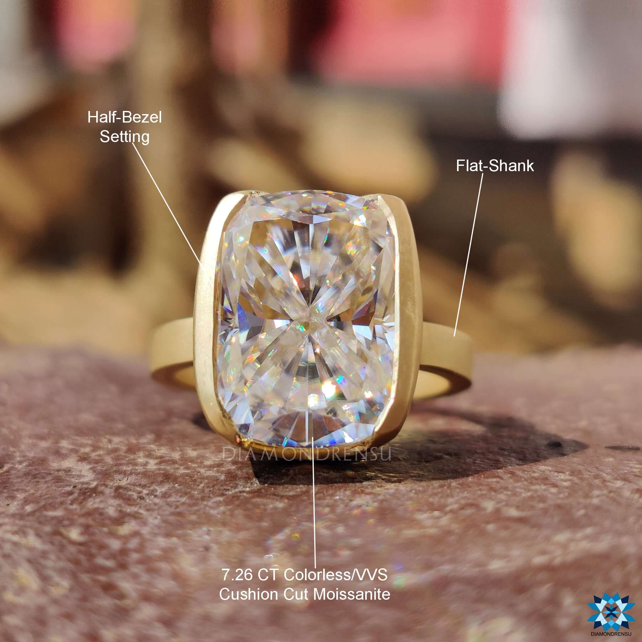 Solitaire engagement ring with half bezel setting.