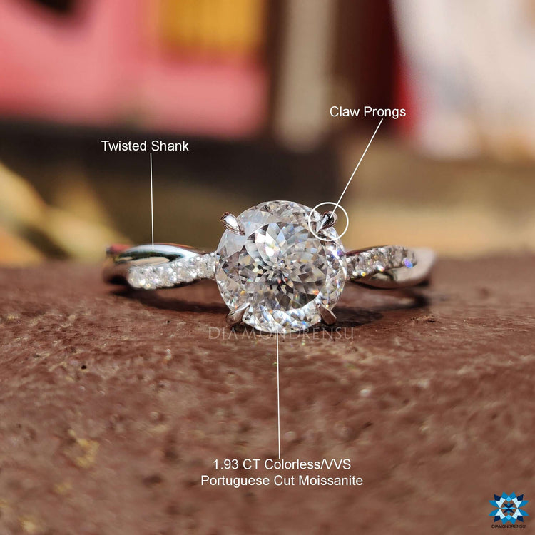 White gold twisted band ring with Portuguese moissanite center stone.