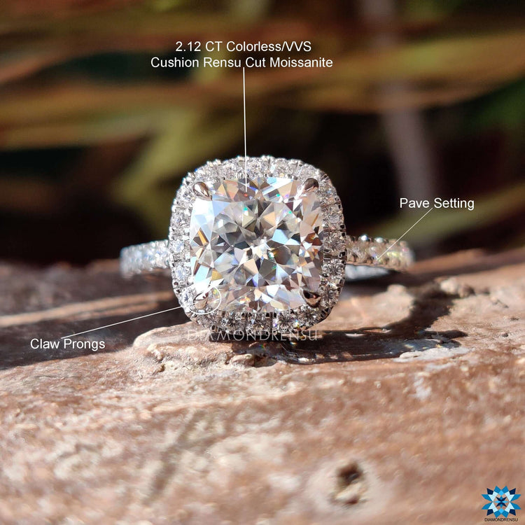 Cushion cut halo ring crafted in white gold with prong setting.