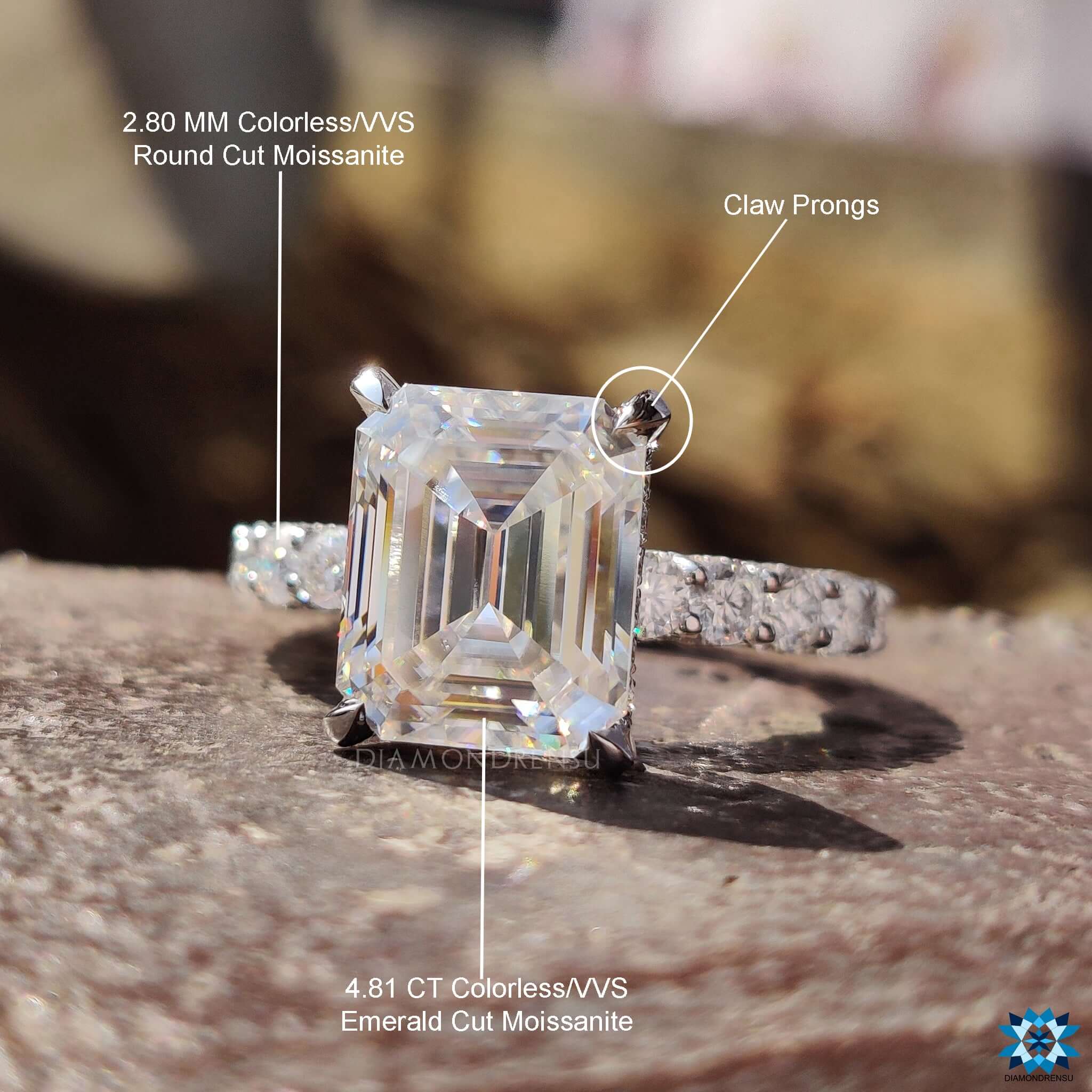 Custom engagement ring featuring emerald cut center stone.