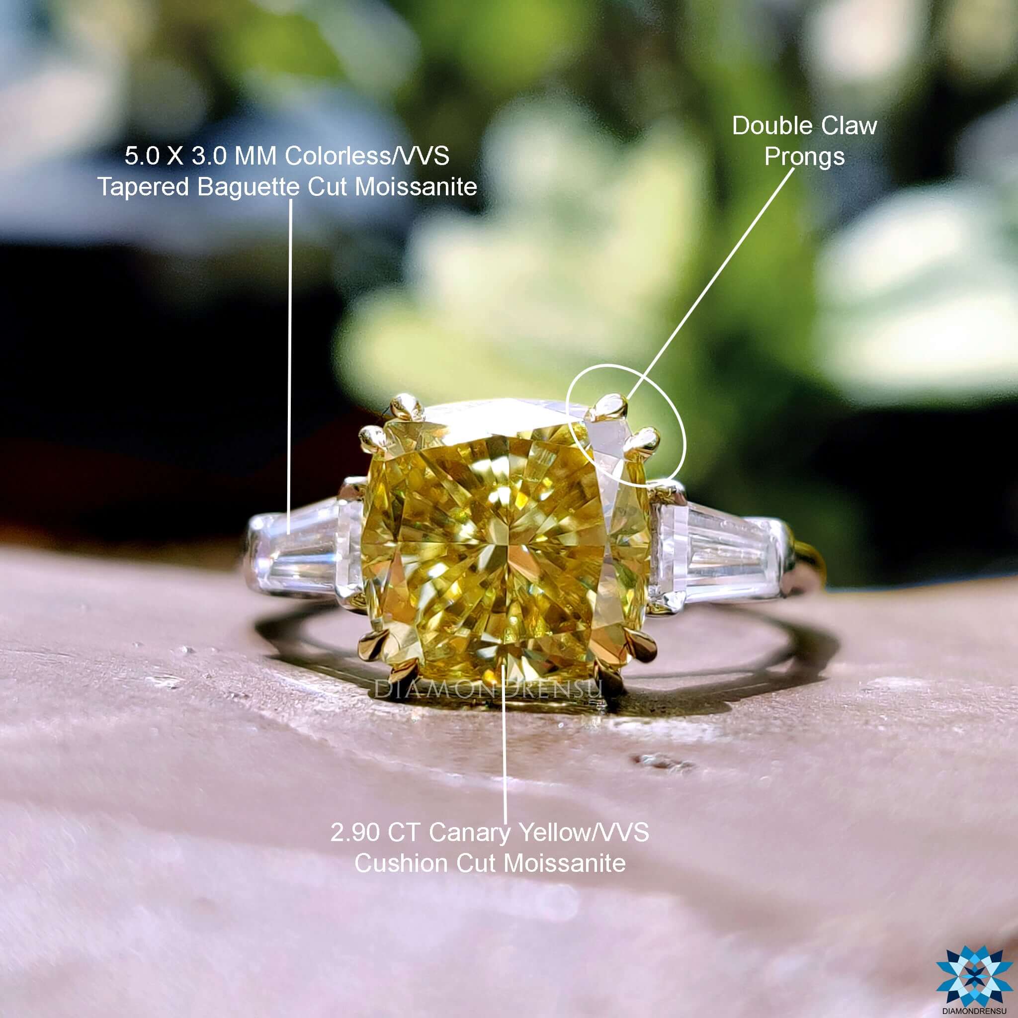 Cathedral setting engagement ring with three stones.