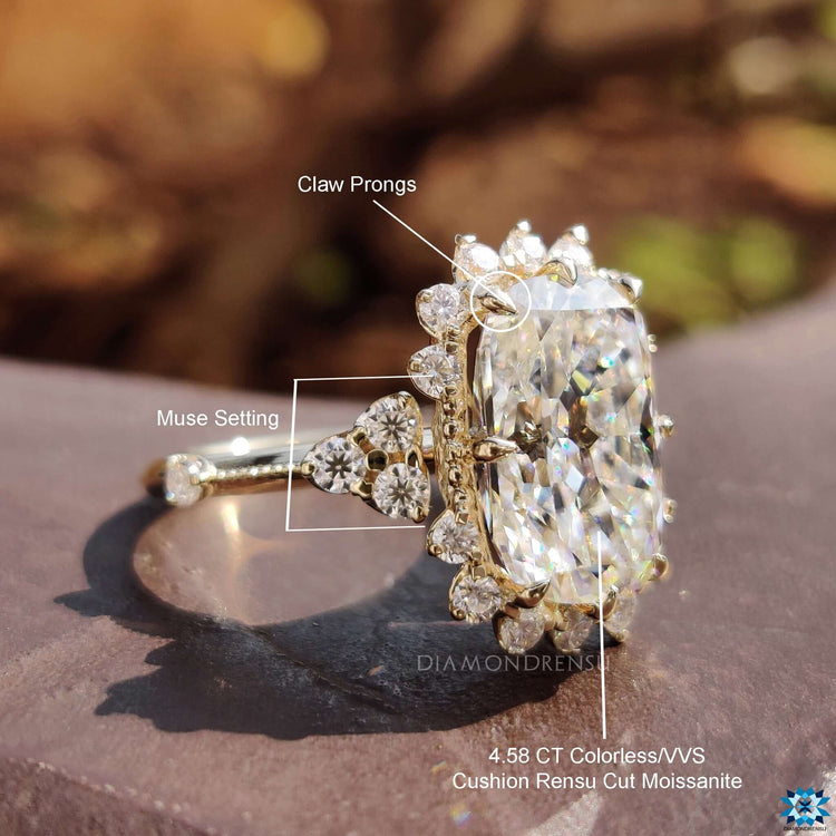 Prong set cushion ring with handcrafted details.