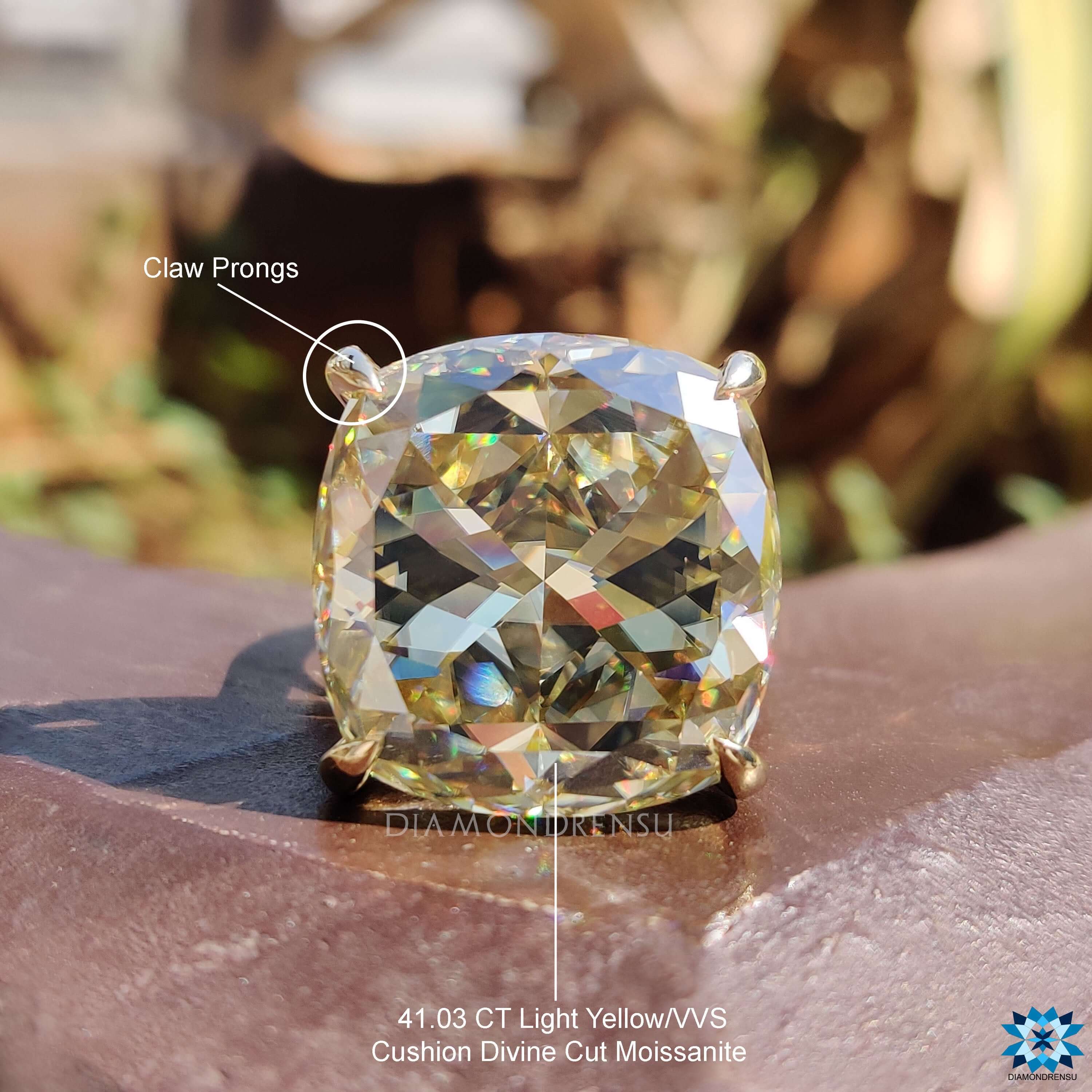 Cathedral setting engagement ring with cushion stone.