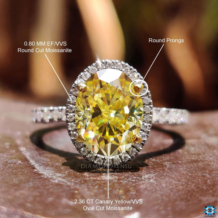 Handmade moissanite ring with yellow and white gold details.