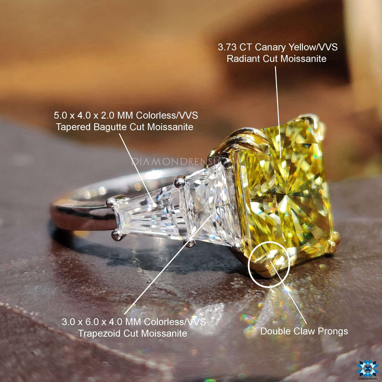 Double claw prong ring holding a radiant moissanite.
