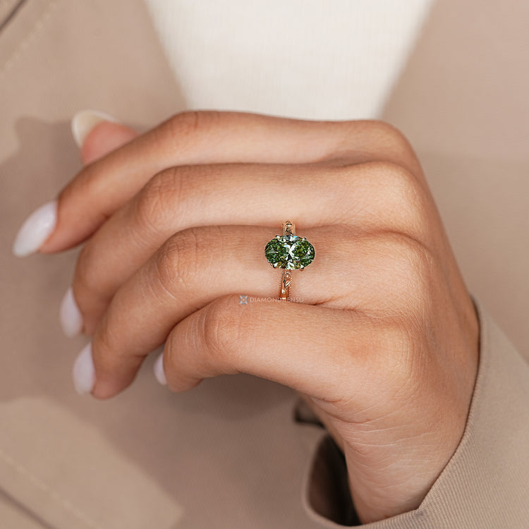 Handmade green diamond ring with hidden flower design.